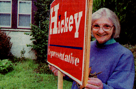 old woman with voting sign